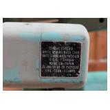 White Zigzag Stitcher Sewing Machine in Wood Cabinet