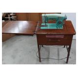 White Zigzag Stitcher Sewing Machine in Wood Cabinet