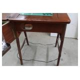 White Zigzag Stitcher Sewing Machine in Wood Cabinet