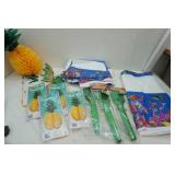 12" & 16" tissue Pineapples, poly tablecloths, palm tree centerpieces