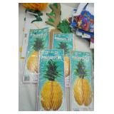 12" & 16" tissue Pineapples, poly tablecloths, palm tree centerpieces