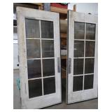 A SET OF TWO HEAVY DUTY STEEL AND GLASS METAL SAFETY DOORS