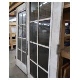 A SET OF TWO HEAVY DUTY STEEL AND GLASS METAL SAFETY DOORS