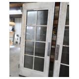 A SET OF TWO HEAVY DUTY STEEL AND GLASS METAL SAFETY DOORS