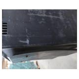 BLACK CAST IRON STOVE ON STAND WITH ROOF VENT