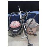 TWO SHOP VACS WHIT HOSES AND EXTENSIONS