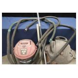 TWO SHOP VACS WHIT HOSES AND EXTENSIONS