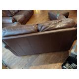 Brown leather couches with ottoman