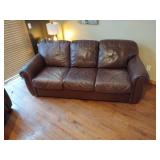 Brown leather couches with ottoman