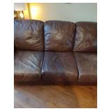 Brown leather couches with ottoman