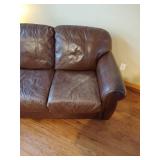 Brown leather couches with ottoman