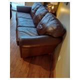 Brown leather couches with ottoman