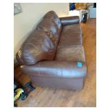 Brown leather couches with ottoman