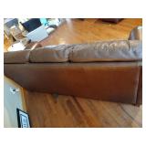 Brown leather couches with ottoman