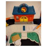 Little people train station and parking garage with train and figures