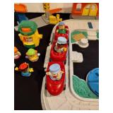 Little people train station and parking garage with train and figures