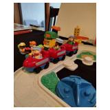 Little people train station and parking garage with train and figures