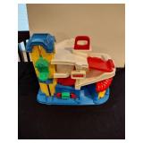 Little people train station and parking garage with train and figures