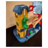 Little people train station and parking garage with train and figures