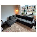 Gray sectional couch with ottoman