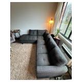 Gray sectional couch with ottoman