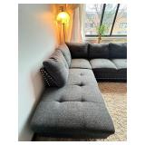 Gray sectional couch with ottoman
