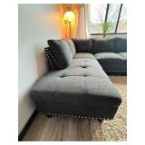 Gray sectional couch with ottoman