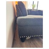 Gray sectional couch with ottoman
