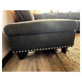 Gray sectional couch with ottoman
