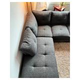 Gray sectional couch with ottoman