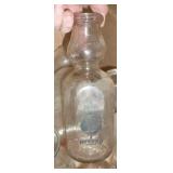 Box of vintage milk bottles