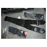 50 guitar straps in a cardboard drum case