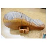 Vintage lure and clay pigeons, hide-a-key wood carving and welcome sign