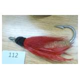 Vintage lure and clay pigeons, hide-a-key wood carving and welcome sign