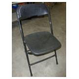 Stack of 20 folding chairs