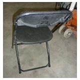 Stack of 20 folding chairs