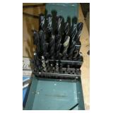 lug nuts, drill bits, small socket set