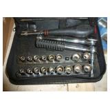 lug nuts, drill bits, small socket set
