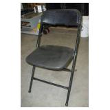 Stack of 40 folding chairs