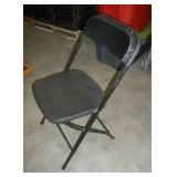 Stack of 40 folding chairs