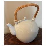 Two Teapots with Teacups including a Cast Iron Tea Kettle