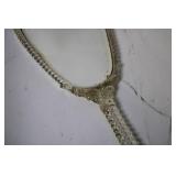 Vintage Handheld Mirror with Ornate Carved Handle and Floral Artwork