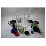 Assorted Glassware and Kitchen Measuring Tools Collection
