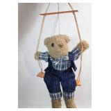 Plush Teddy Bear on Wooden Swing in Checked Outfit