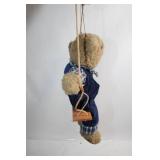 Plush Teddy Bear on Wooden Swing in Checked Outfit