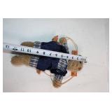 Plush Teddy Bear on Wooden Swing in Checked Outfit