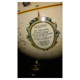 Vintage Replogle Globe and Cast Iron bookends.