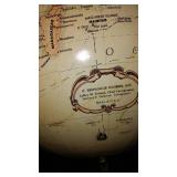 Vintage Replogle Globe and Cast Iron bookends.