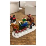 Holiday-Themed Ceramic Figurine Set with Motorcycle and Sled
