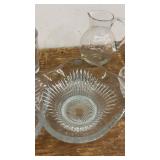 Collection of Glassware Including Bowls, Dishes, and Blue Stemmed Glasses